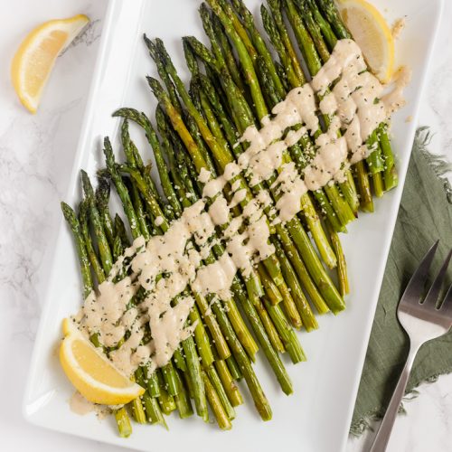 https://cleanplatemama.com/wp-content/uploads/2019/12/Roasted-Asparagus-with-Lemon-Tahini2.2-2-1-500x500.jpg