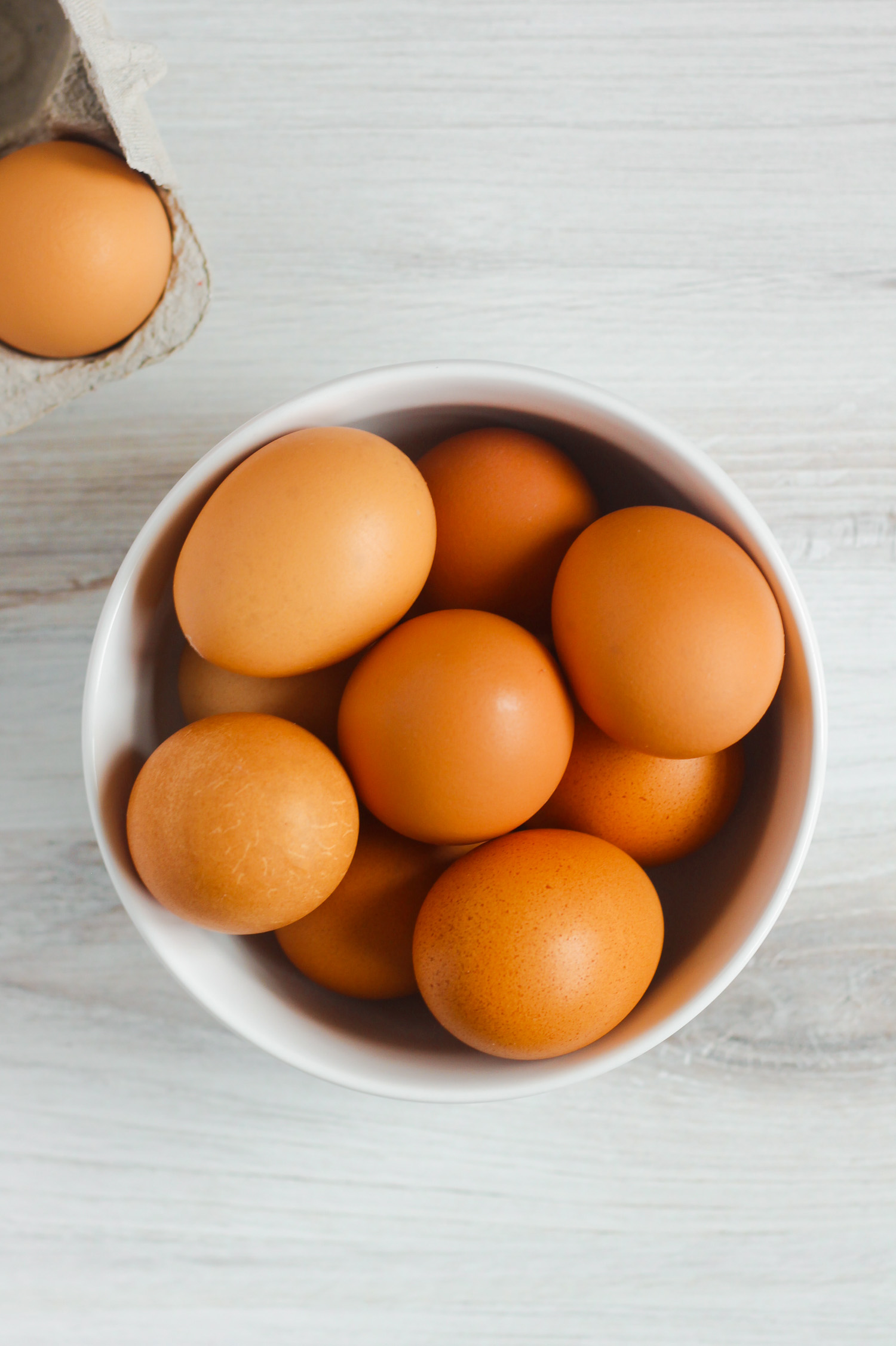 brown eggs in white bowl