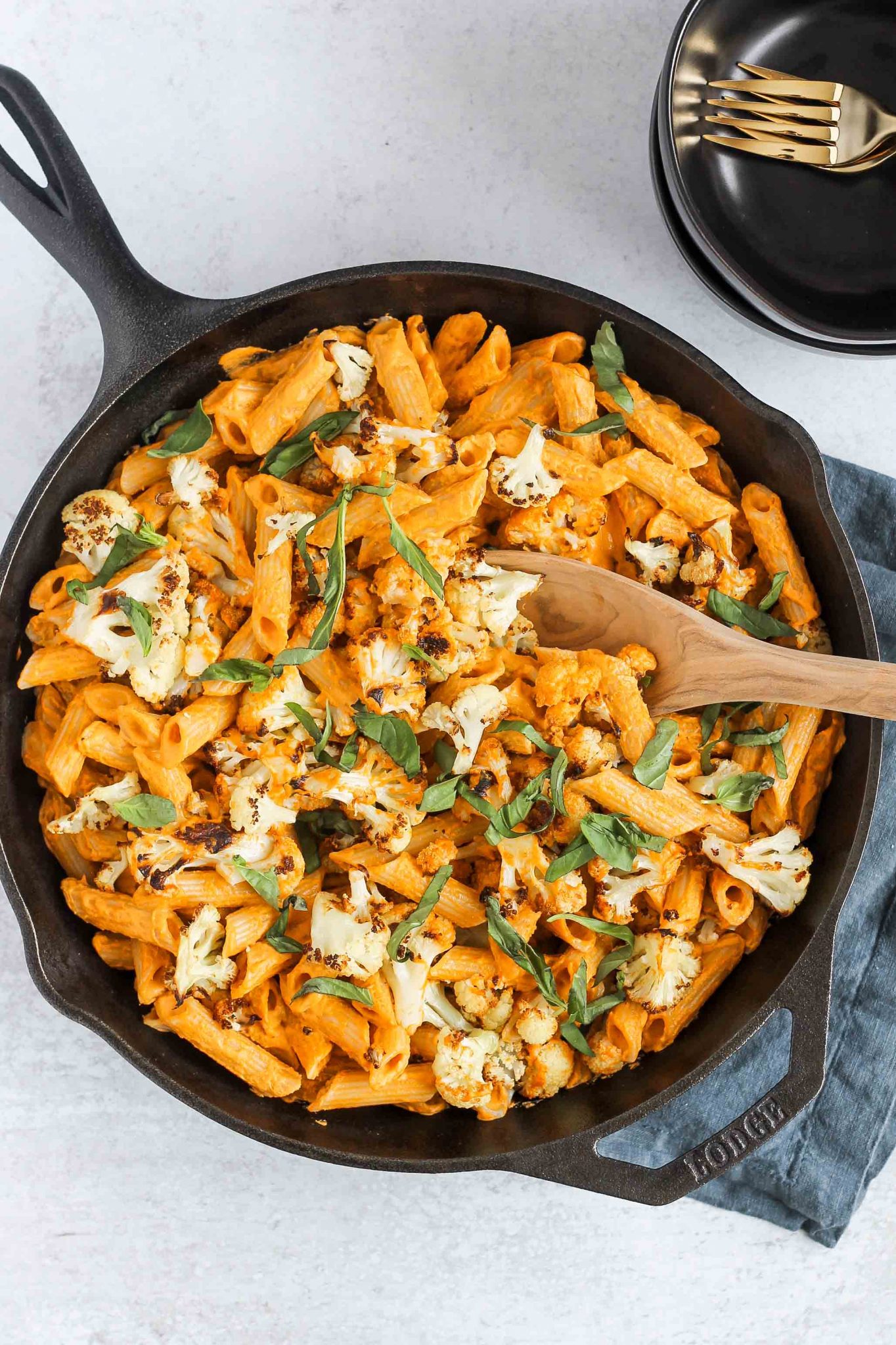 penne pasta tossed in roasted red peppers sauce androasted cauliflower