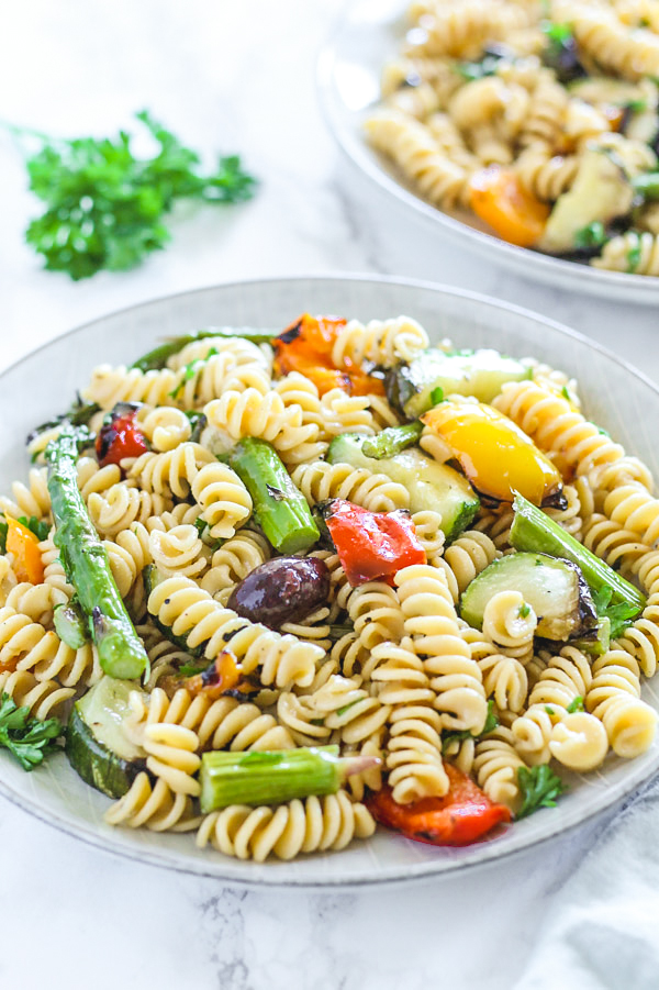 close-up view of grilled vegetable pasta salad on round plate