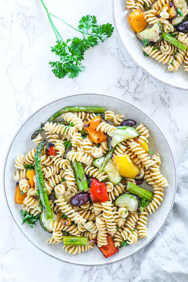 grilled vegetable pasta salad in single serve round plate