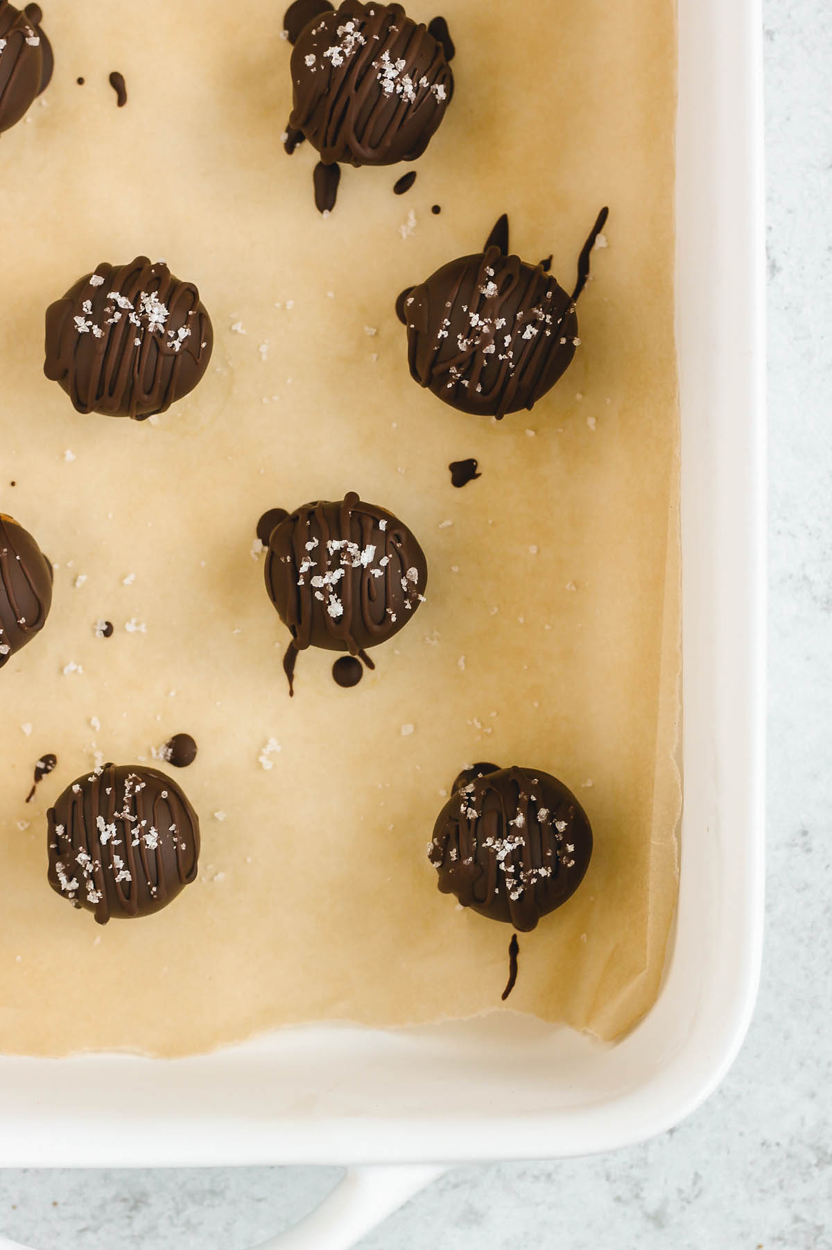 chocolate covered peanut butter balls sprinkled with sea salt