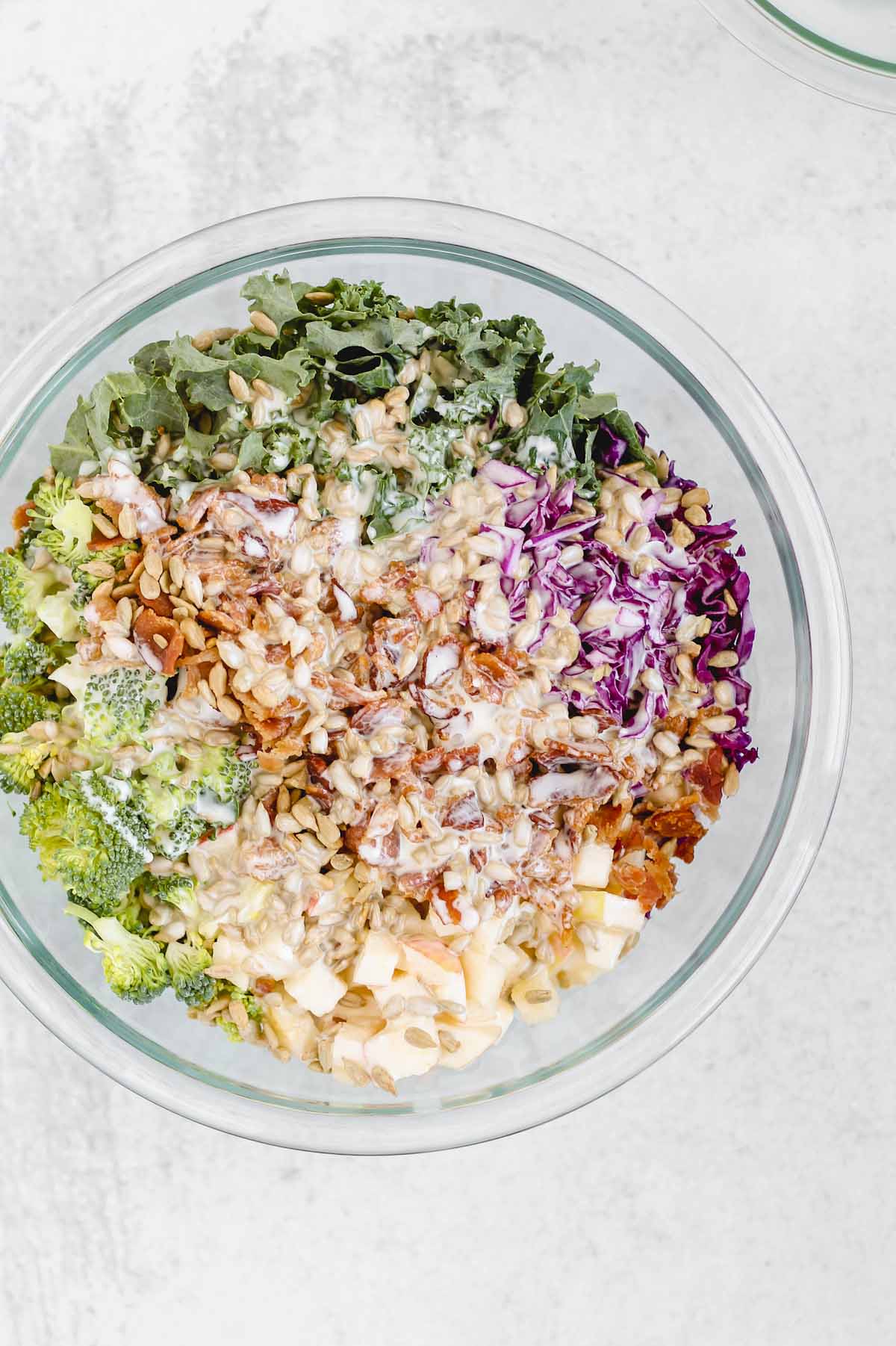 broccoli kale salad with dressing poured on top