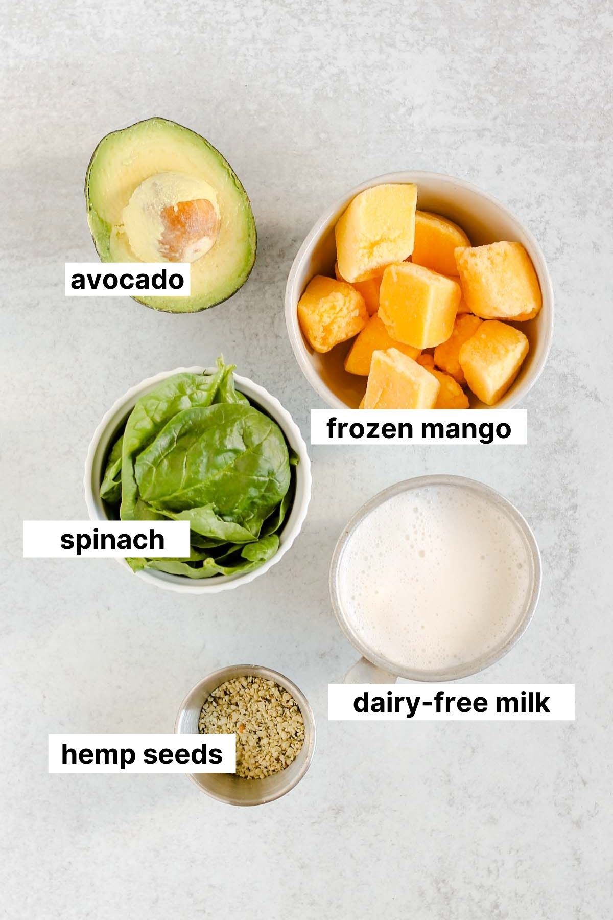 Labeled ingredients for mango spinach smoothie.