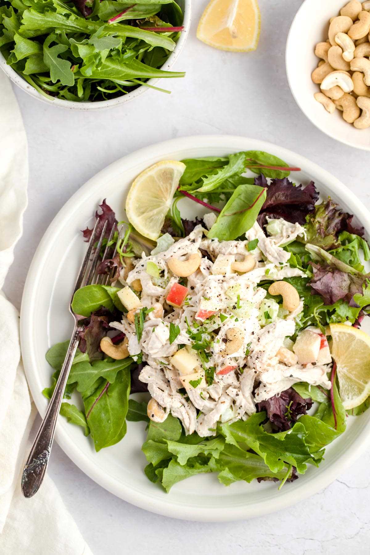 Chicken salad on a bed of spring mix.