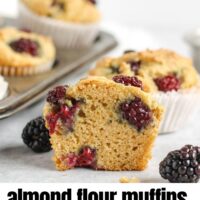 cut in half blackberry muffin with text overlay "almond flour blackberry muffins".