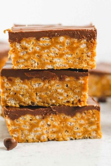 Healthier scotcheroo bars stacked 3 high.