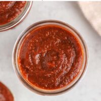 BBQ sauce in a mason jar with text overlay "homemade BBQ sauce. Whole 30 + Paleo."