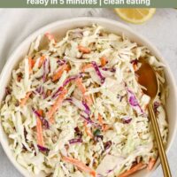 Coleslaw in a bowl with text overlay "creamy paleo + whole30 coleslaw."