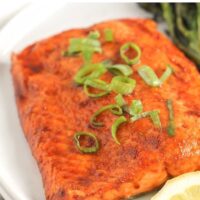 Salmon fillet with text overlay "best frozen salmon in the air fryer."