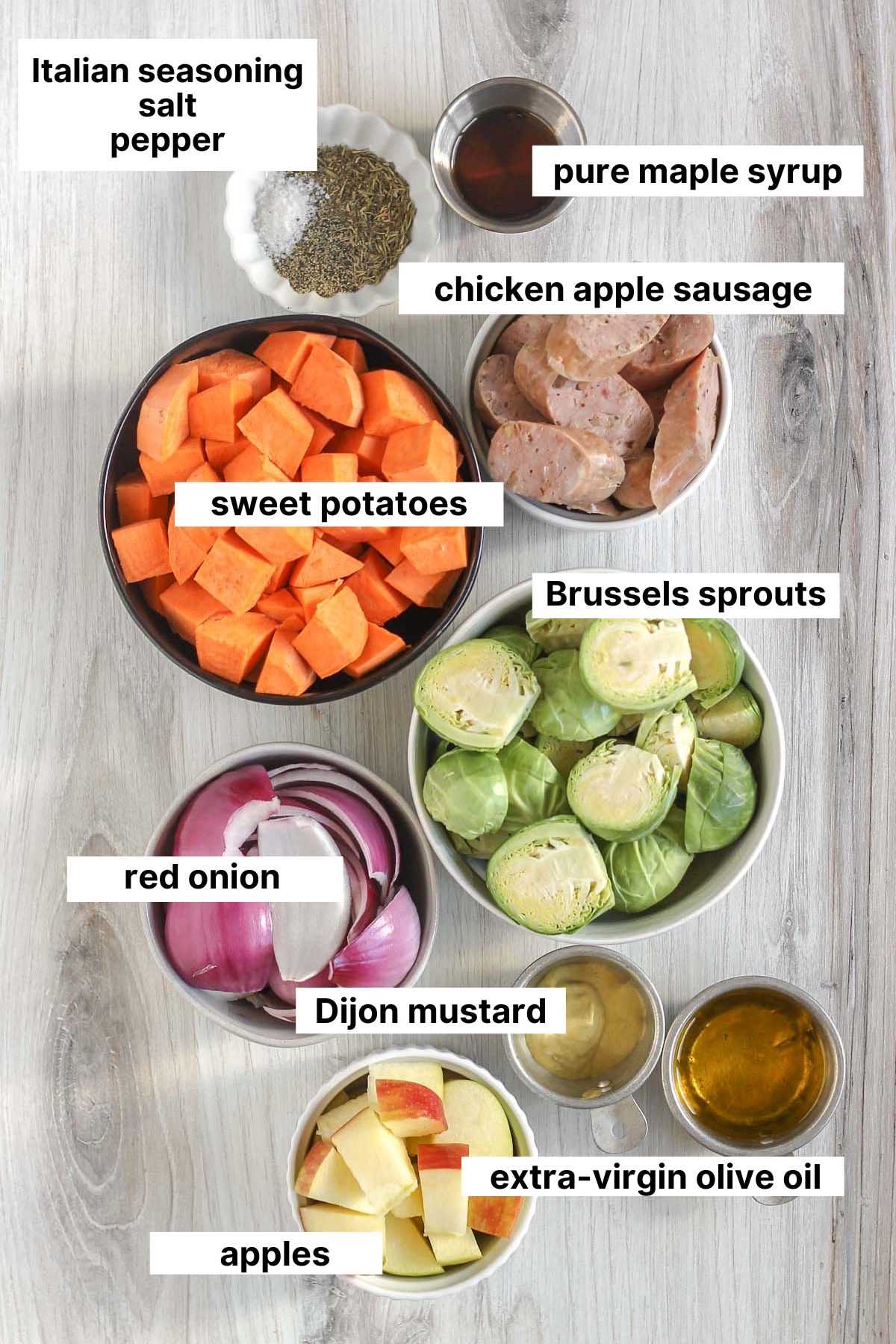 Labeled ingredients needed for chicken apple sausage sheet pan dinner.