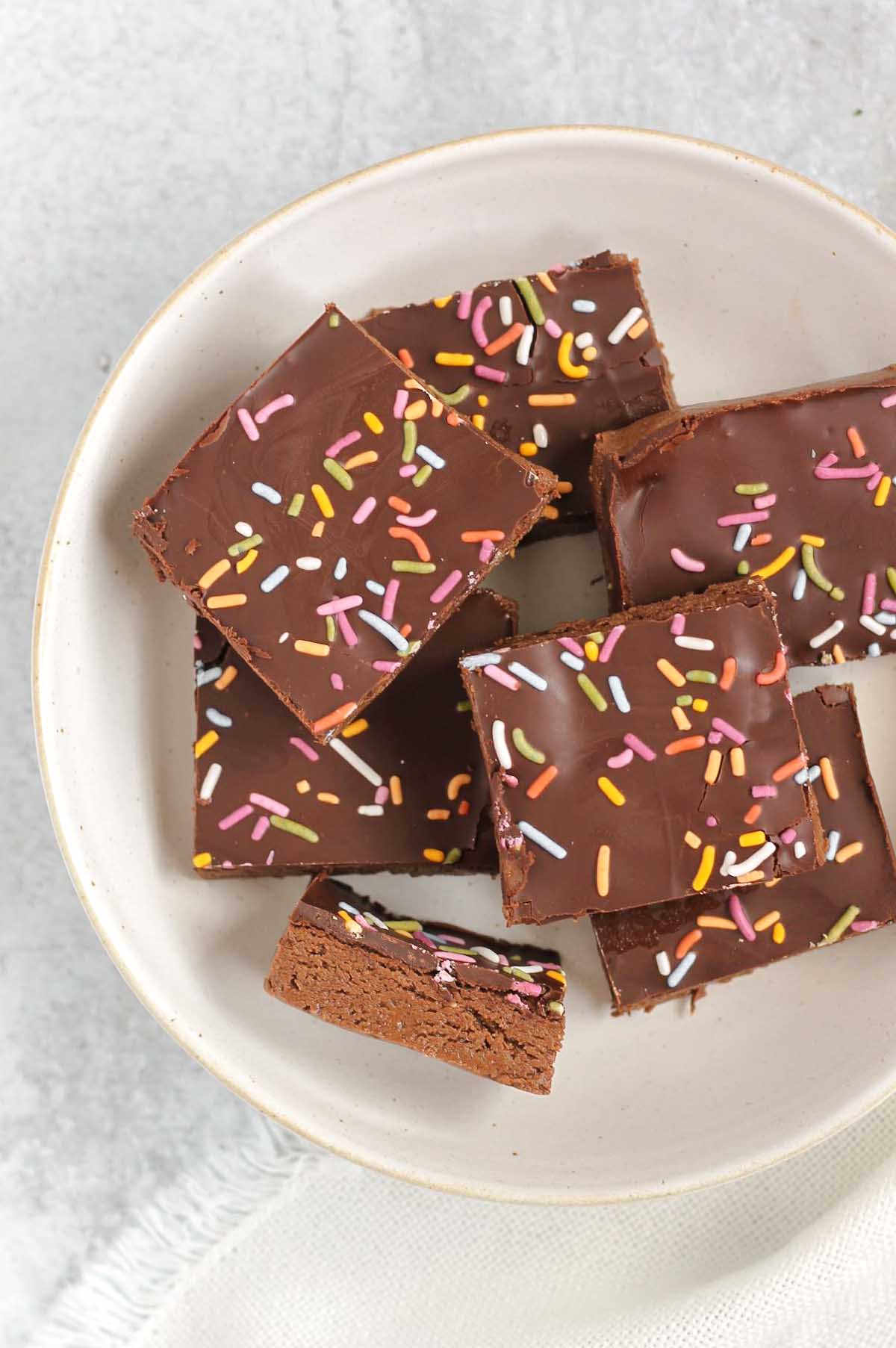 Chocolate protein with sprinkles laid out on a white plate.