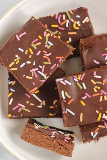 Chocolate protein with sprinkles laid out on a white plate.