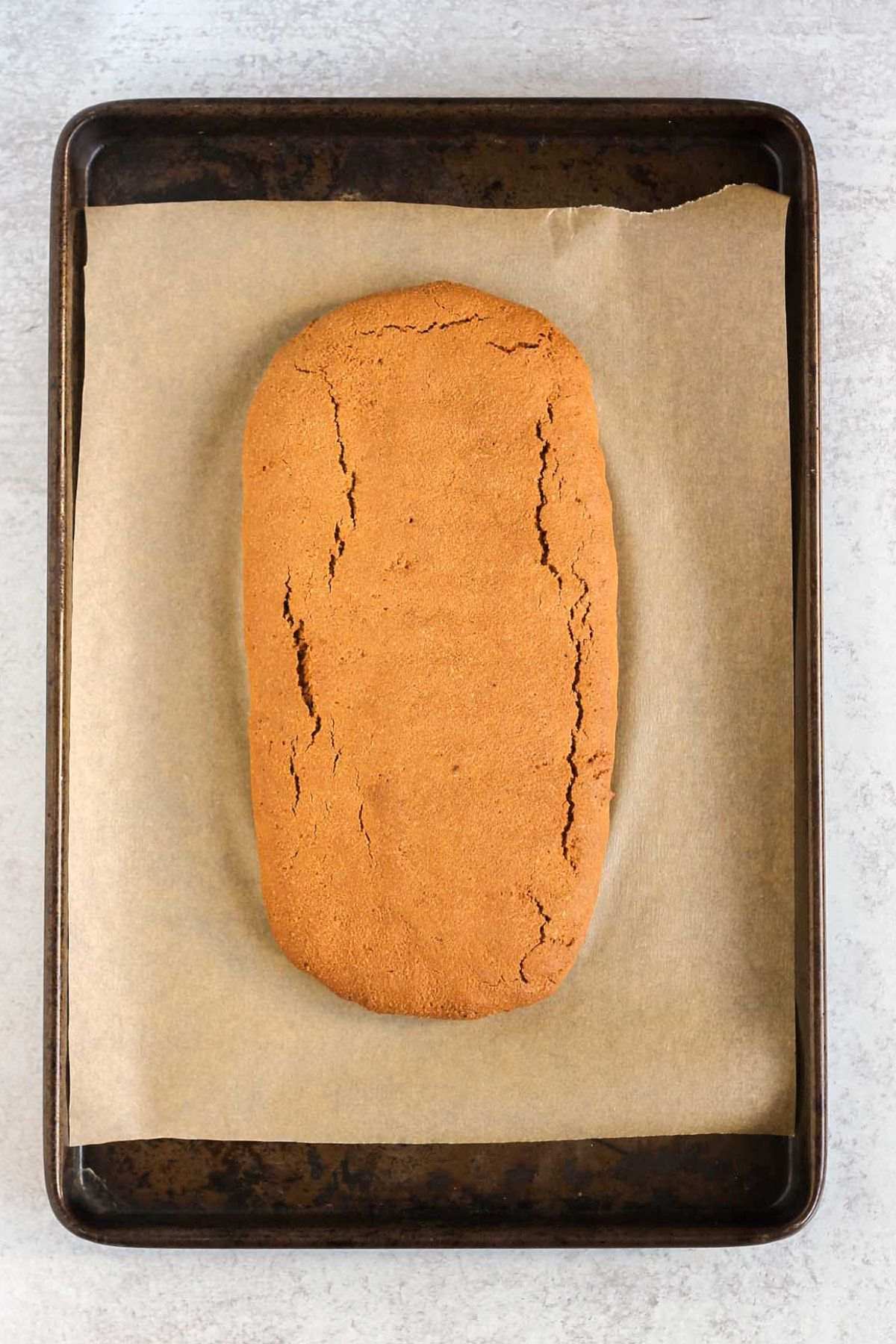 Baked biscotti log before being cut into slices.