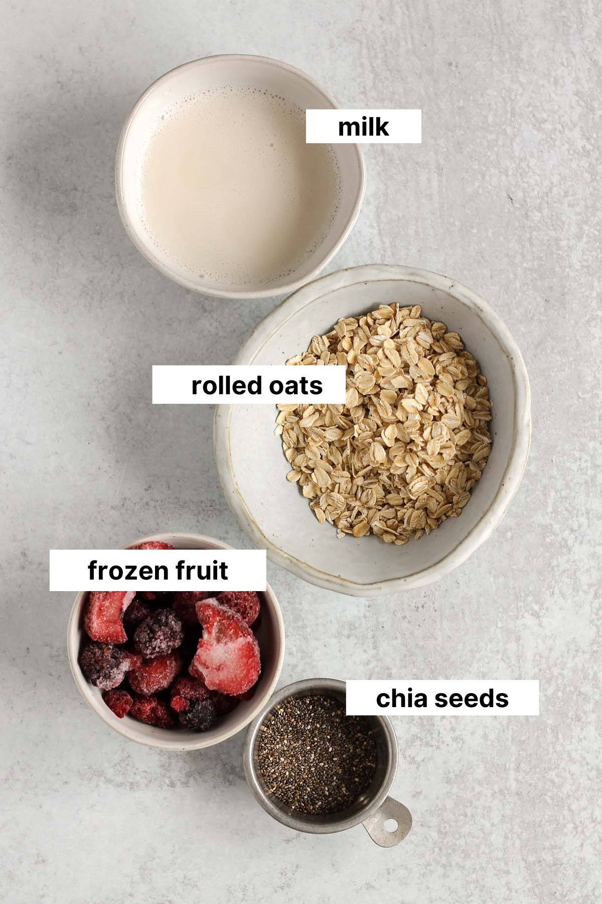 Labeled ingredients for overnight oats with frozen fruit.