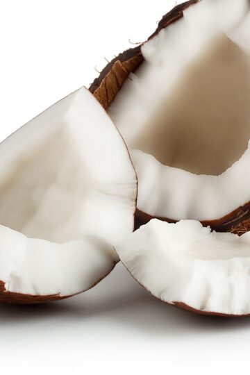 Coconut broken open to show meat of the coconut.