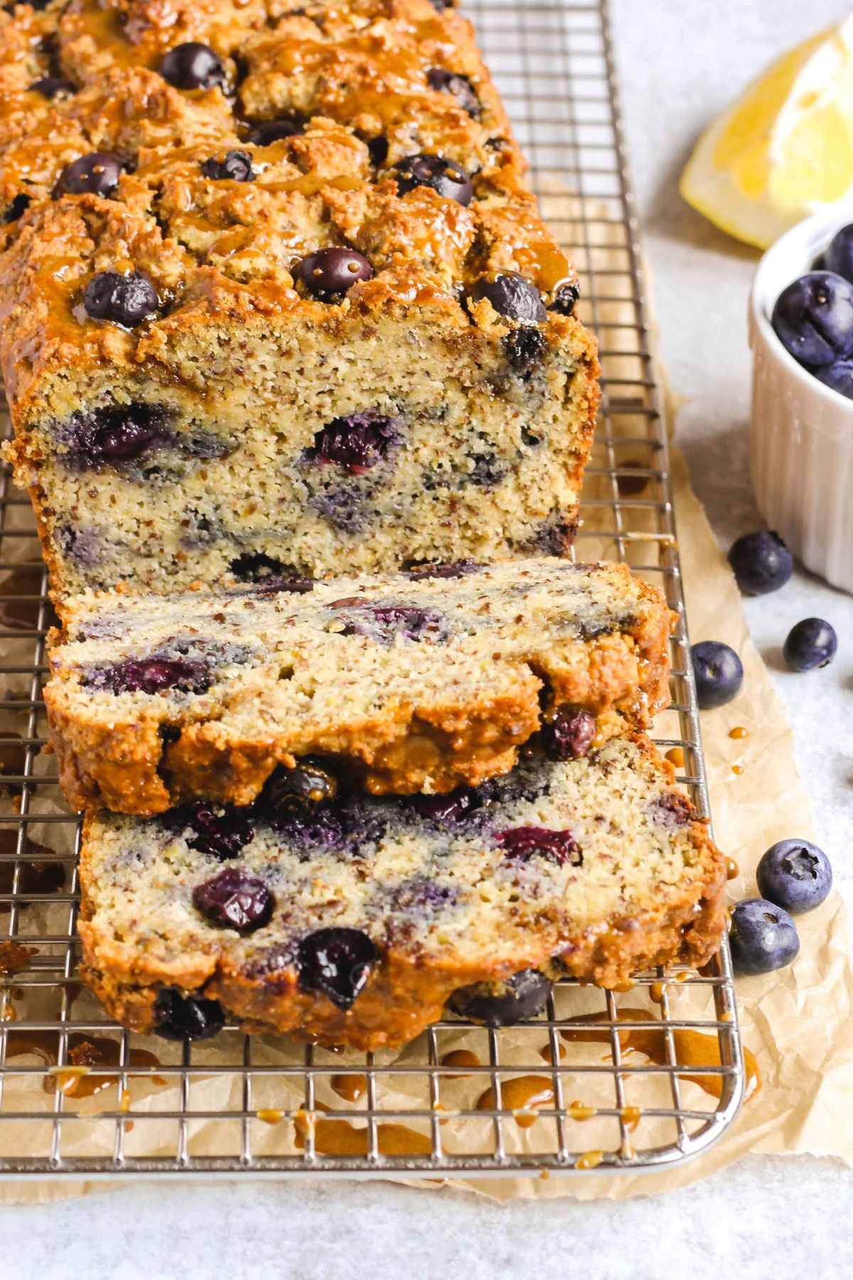 Sliced loaf of almond flour blueberry lemon bread.