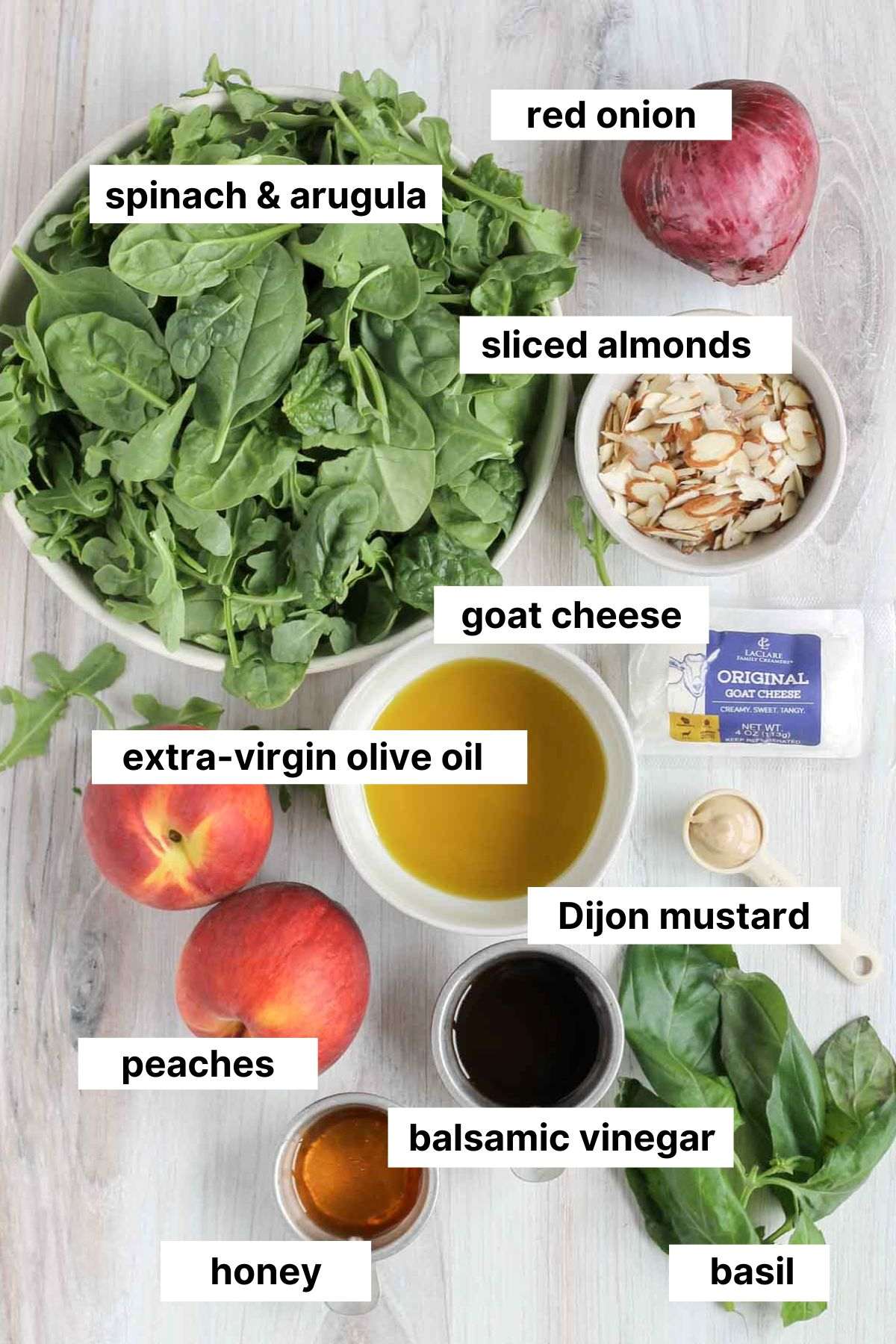 Labeled ingredients for peach and goat cheese salad.
