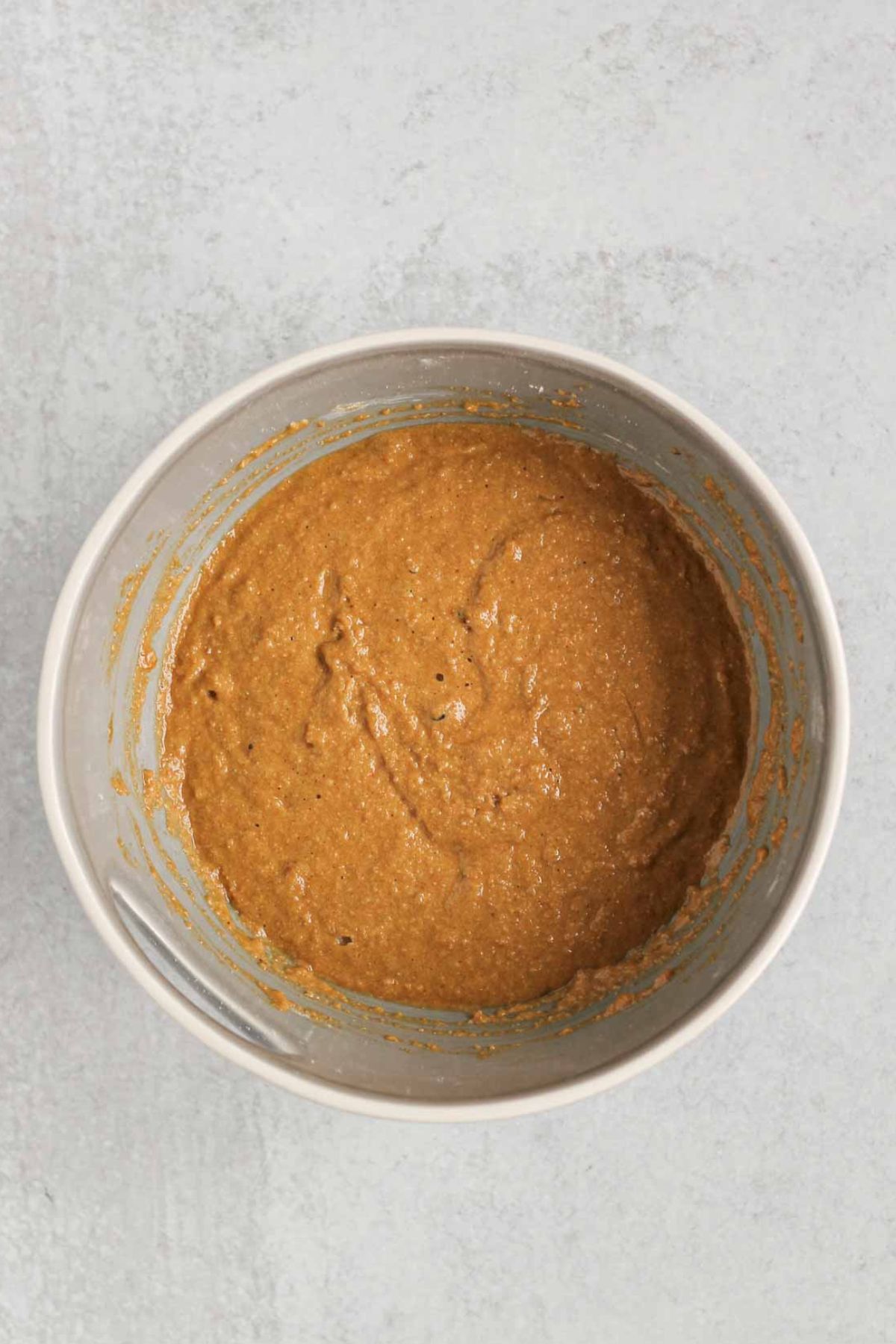 Apple bread batter in a mixing bowl.