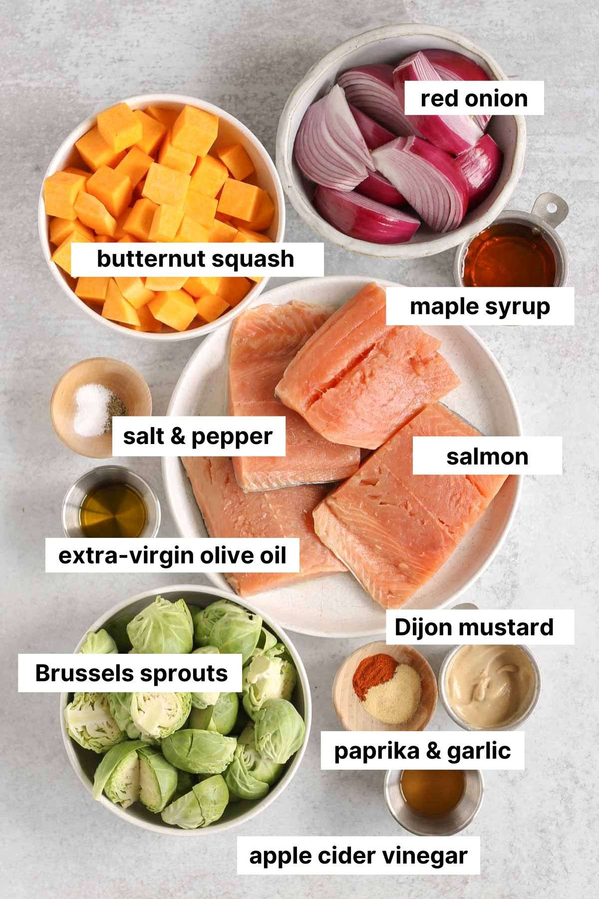 Labeled ingredients for maple salmon sheet pan dinner.