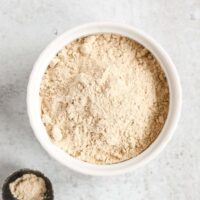 Coconut powdered sugar in a small white dish.