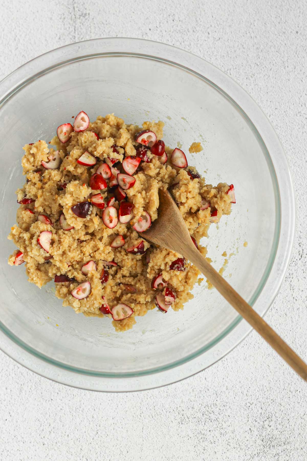 Almond flour cookie dough mixed with sliced cranberries.