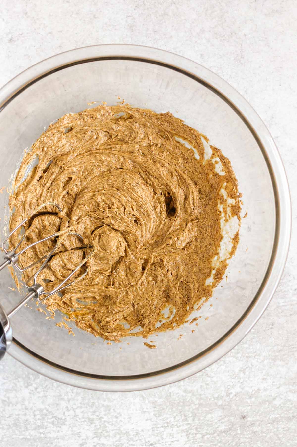 Butter, coconut sugar, egg and vanilla mixed together in a mixing bowl.