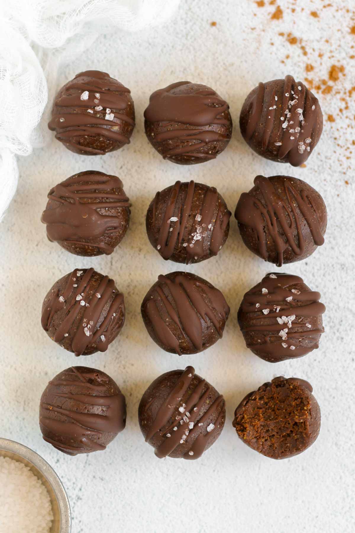Twelve protein brownie balls laid out in a 3x4 rectangle.