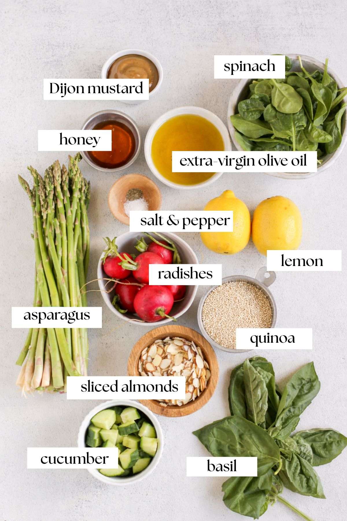 Labeled ingredients for asparagus and quinoa salad.