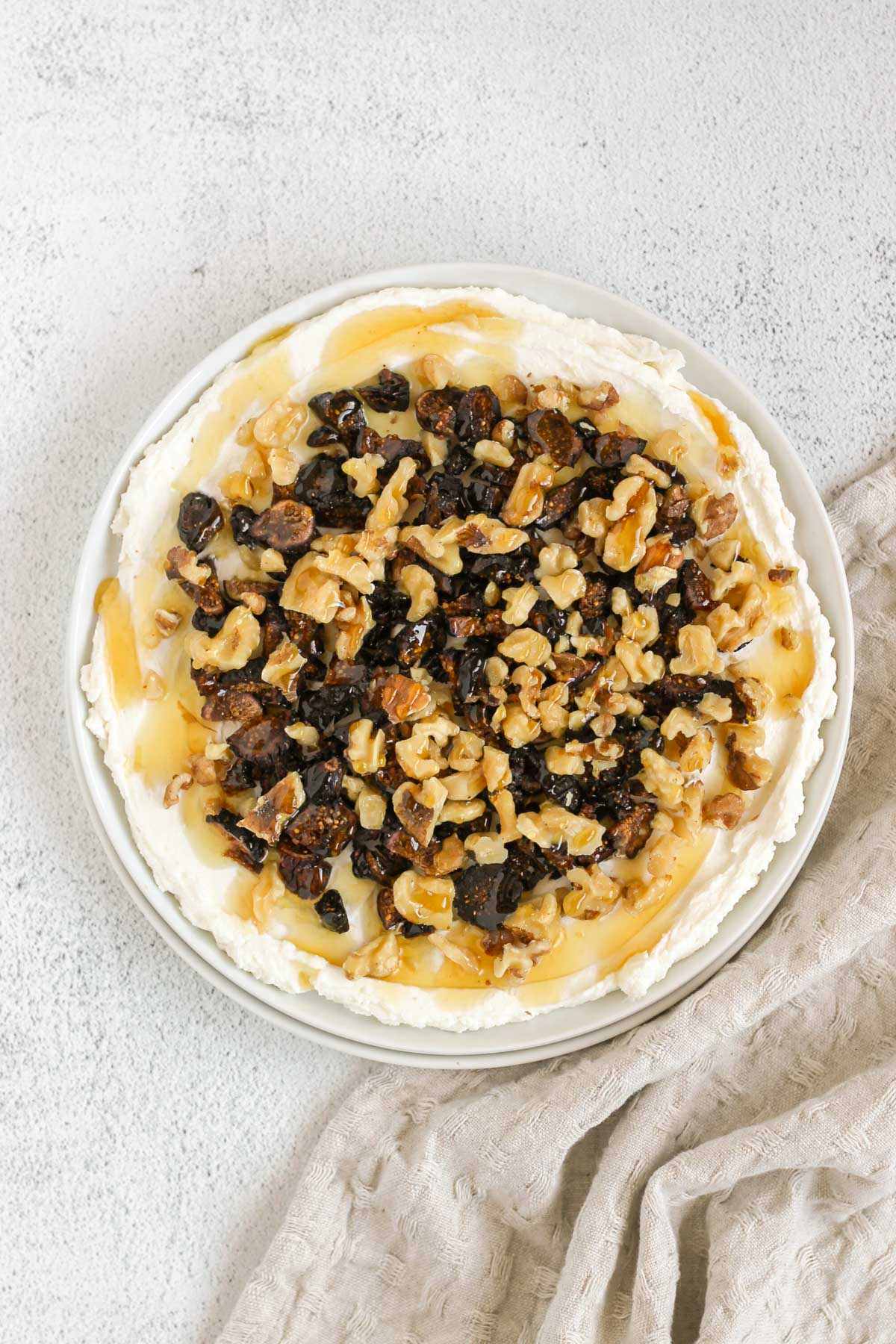 Whipped goat cheese topped with honey, sliced dried figs and walnuts.