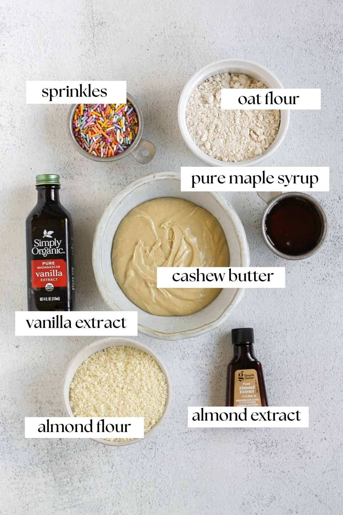 Labeled ingredients for birthday cake protein balls.