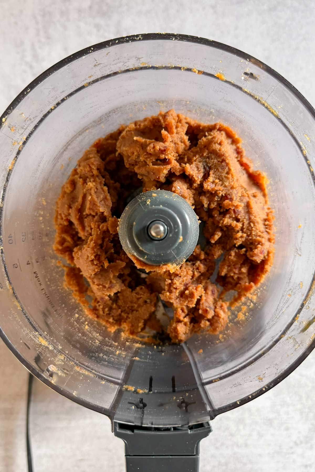 Pumpkin pie truffle filling in a food processor.